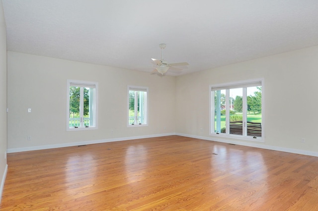 empty room with light hardwood / wood-style floors and ceiling fan