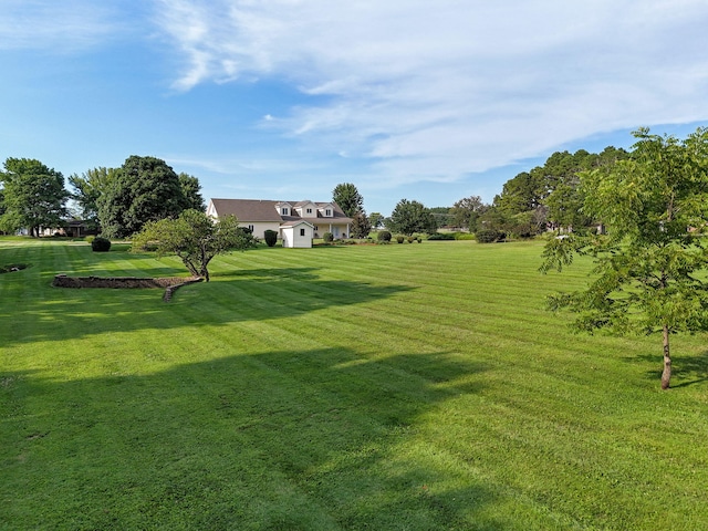 view of home's community with a lawn