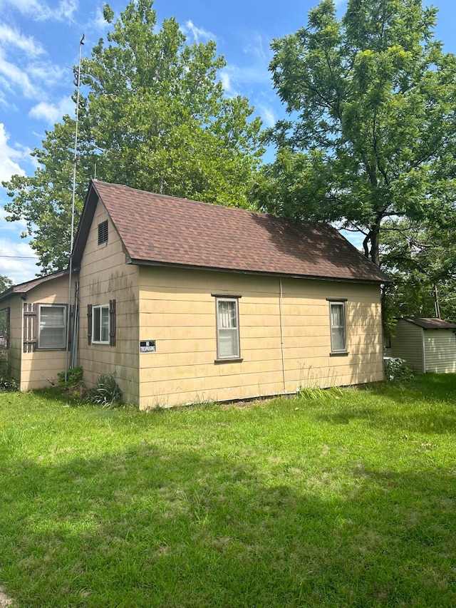 view of property exterior with a lawn