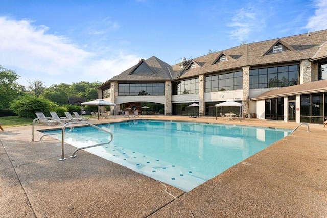 view of swimming pool with a patio area