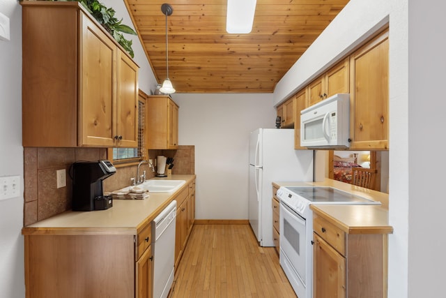 kitchen with light wood-type flooring, wood ceiling, white appliances, sink, and pendant lighting