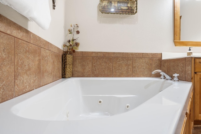 bathroom featuring vanity and a bathtub