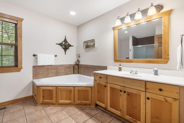 bathroom with vanity, plus walk in shower, and tile patterned floors