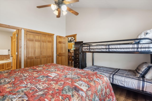 bedroom featuring ceiling fan, connected bathroom, dark hardwood / wood-style flooring, and high vaulted ceiling