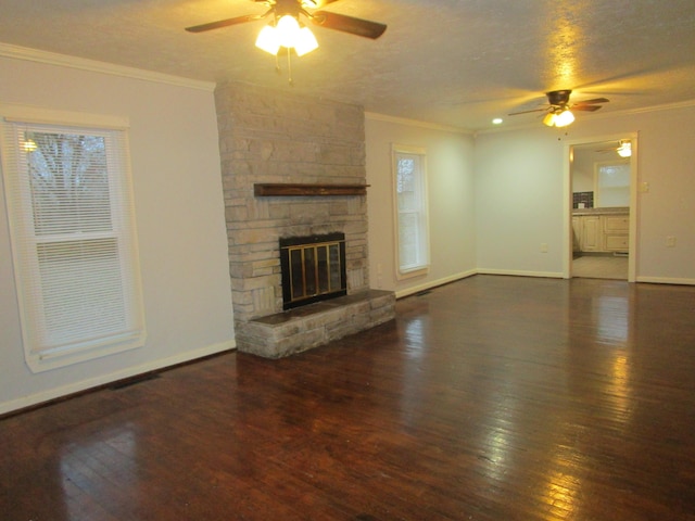 unfurnished living room featuring ceiling fan, dark hardwood / wood-style flooring, and ornamental molding