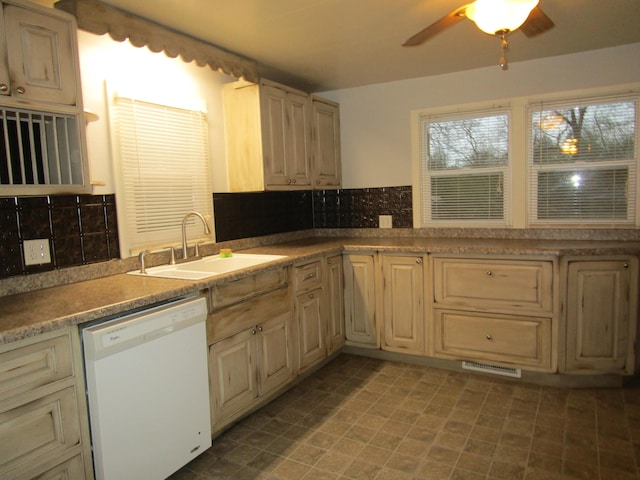 kitchen featuring decorative backsplash, ceiling fan, sink, light brown cabinets, and dishwasher