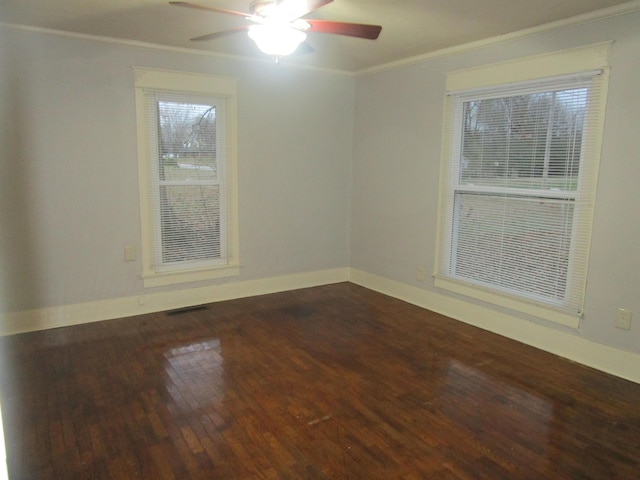 unfurnished room featuring ceiling fan, wood-type flooring, and ornamental molding