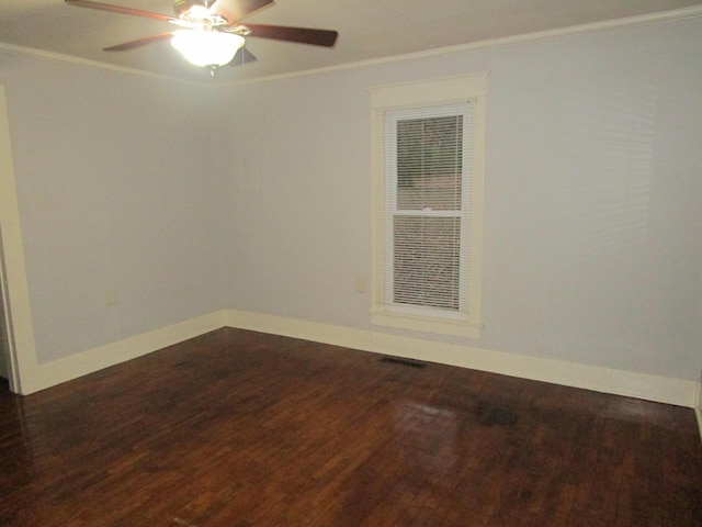 spare room with crown molding, ceiling fan, and wood-type flooring