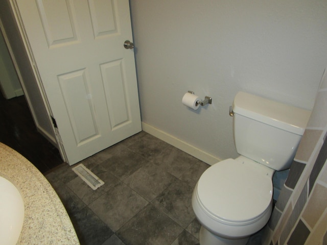 bathroom featuring tile patterned floors and toilet