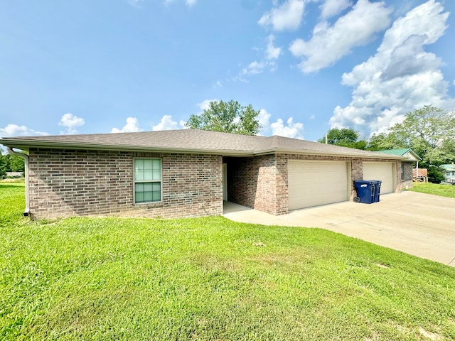 ranch-style house with a garage and a front yard