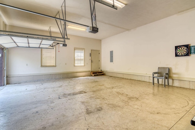 garage with electric panel and a garage door opener