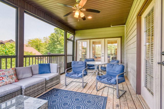 sunroom with wooden ceiling and ceiling fan