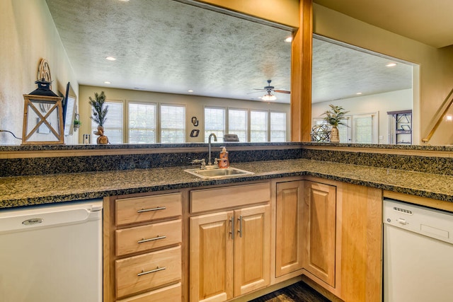 kitchen with sink, a textured ceiling, and white dishwasher