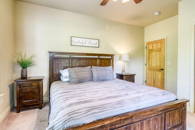 bedroom featuring ceiling fan and light colored carpet