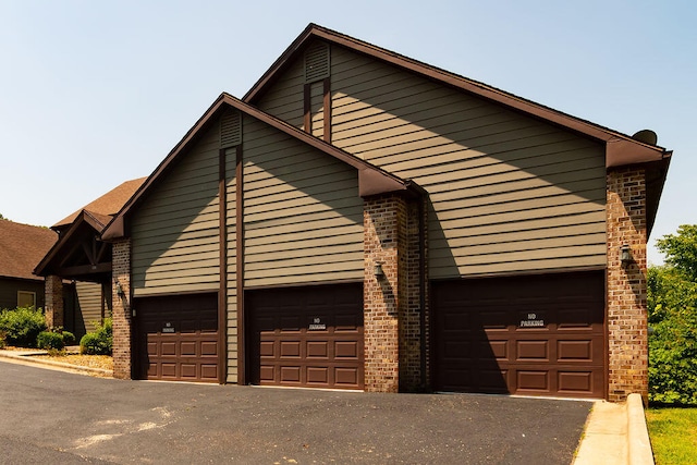 view of side of property featuring a garage