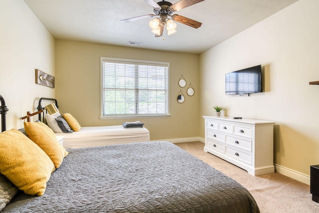 bedroom featuring ceiling fan and light colored carpet