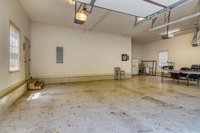 garage featuring a garage door opener and electric panel