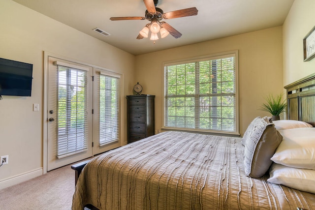 carpeted bedroom with ceiling fan and access to outside