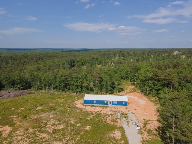 drone / aerial view with a view of trees