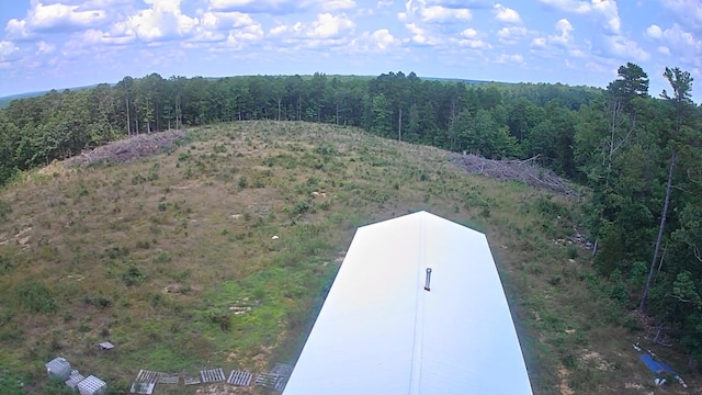 aerial view featuring a wooded view