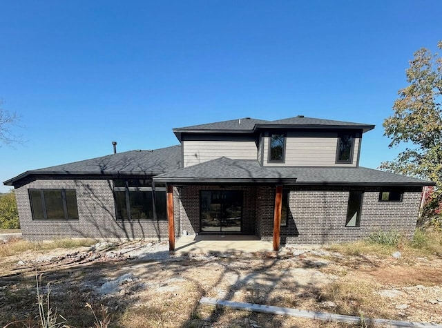 back of house with a patio