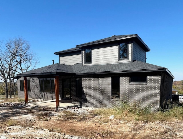 back of property with a patio