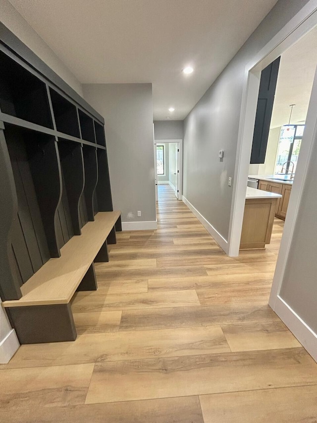 2978 E Kemmling Ln, Springfield, MO 65804 - mudroom featuring light wood finished floors, recessed lighting, baseboards, and a sink