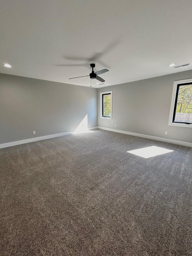 unfurnished room featuring carpet flooring and ceiling fan