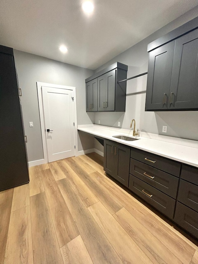 kitchen featuring light hardwood / wood-style flooring and sink