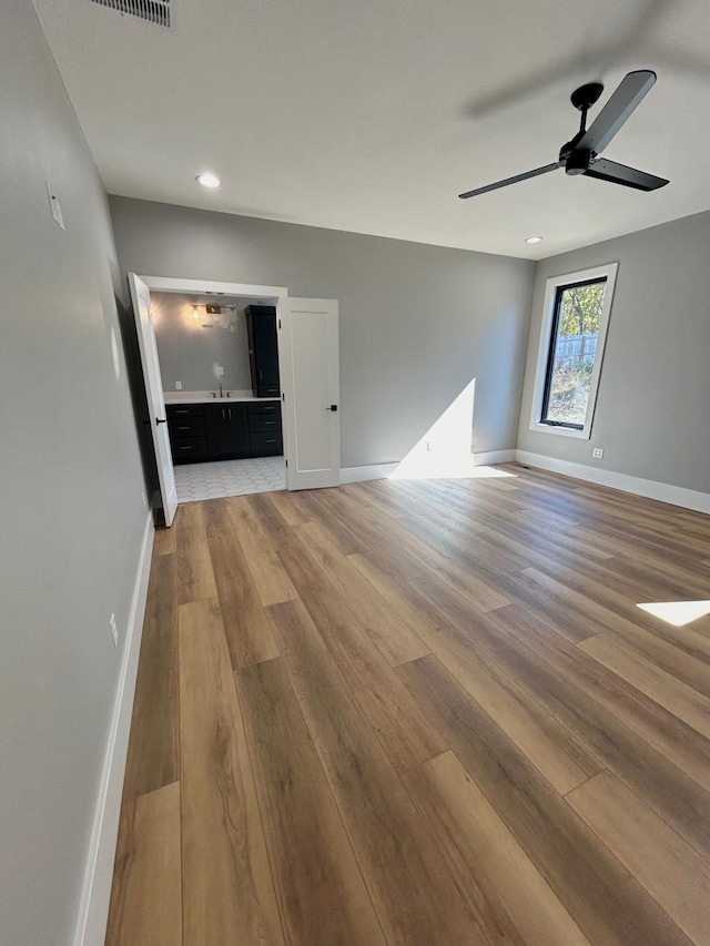 interior space featuring ceiling fan and hardwood / wood-style flooring