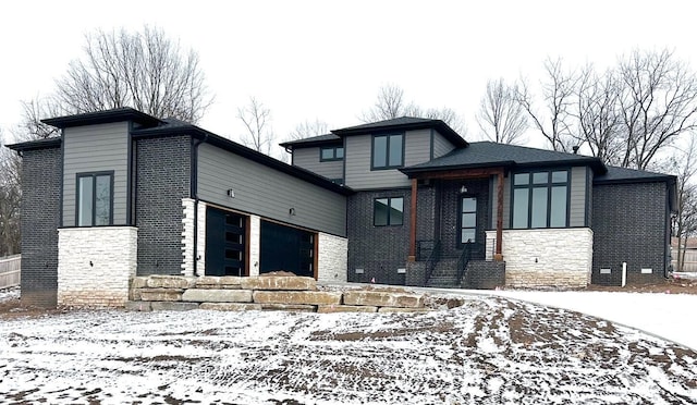 prairie-style home featuring a garage