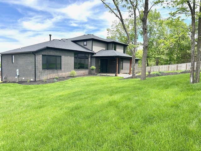 2978 E Kemmling Ln, Springfield, MO 65804 - rear view of house featuring brick siding, roof with shingles, and a patio
