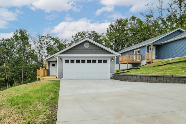 single story home featuring a front yard and a garage