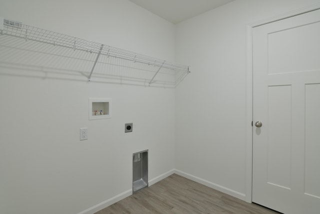 laundry area with washer hookup, light hardwood / wood-style flooring, and hookup for an electric dryer