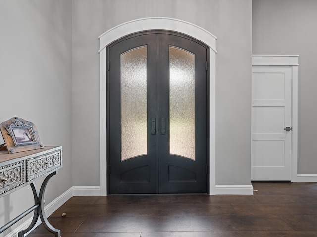 entrance foyer with dark wood-type flooring and french doors