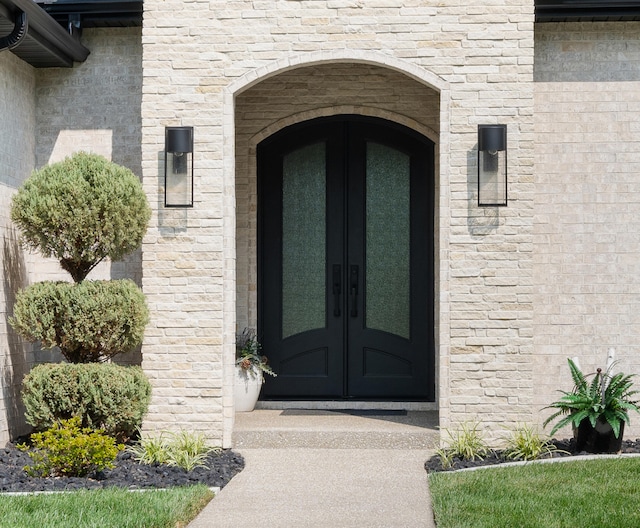 entrance to property featuring french doors