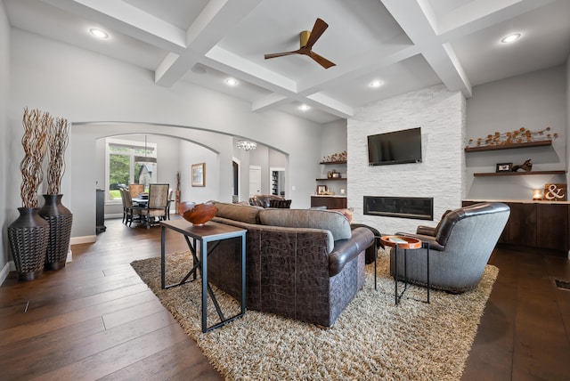 living room with beamed ceiling, coffered ceiling, and dark hardwood / wood-style floors