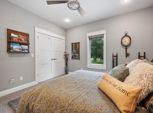 bedroom with ceiling fan, a closet, and carpet