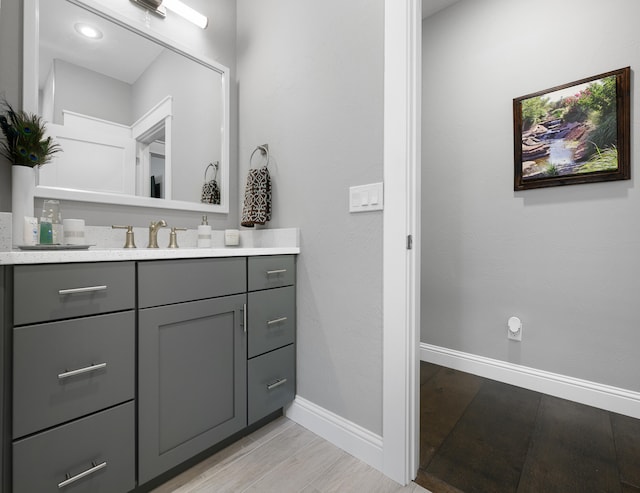 bathroom featuring vanity and wood-type flooring