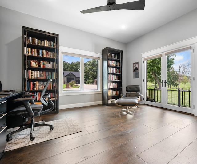 home office with ceiling fan, dark wood-type flooring, and french doors