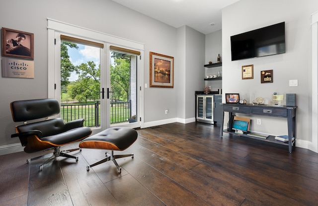 sitting room featuring french doors, beverage cooler, and dark hardwood / wood-style flooring