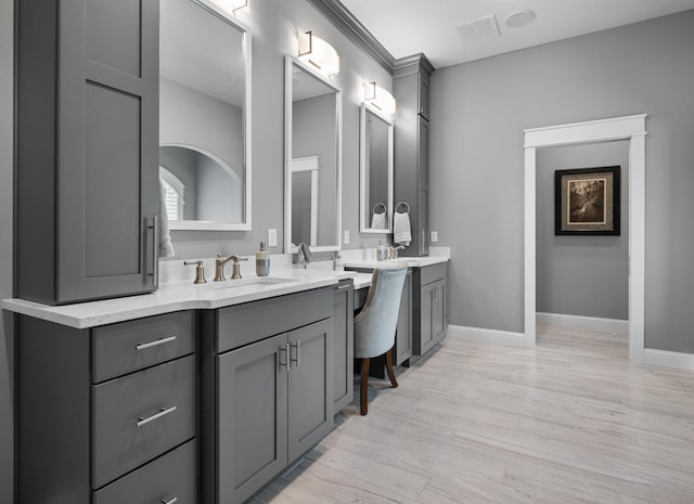 bathroom featuring vanity and hardwood / wood-style flooring