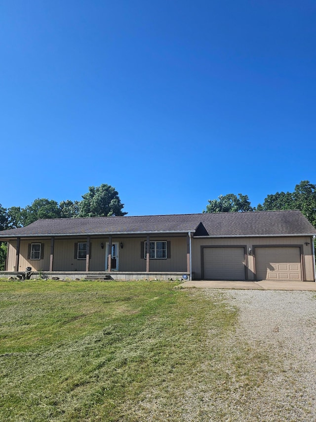 7186 US Highway 60, Mountain View, MO 65548 - view of front facade with a front lawn, gravel driveway, an attached garage, a porch, and roof with shingles