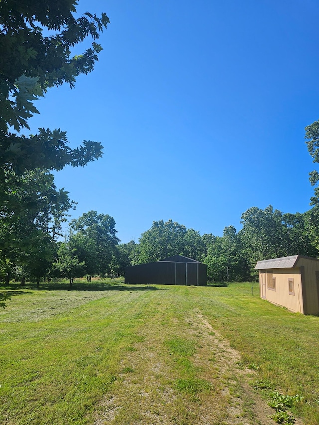 7186 US Highway 60, Mountain View, MO 65548 - view of green lawn with an outdoor structure and an outbuilding