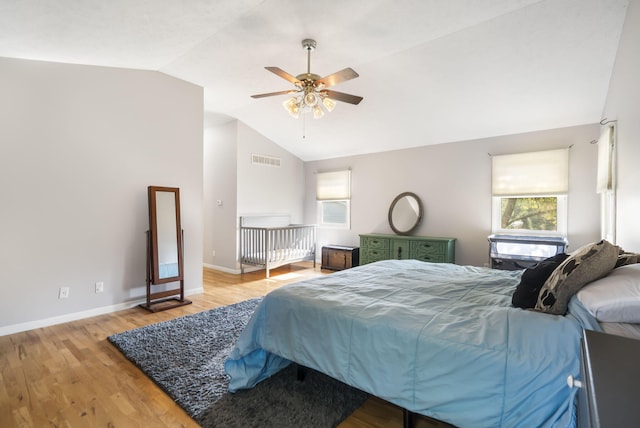 bedroom featuring lofted ceiling, light wood-type flooring, and ceiling fan