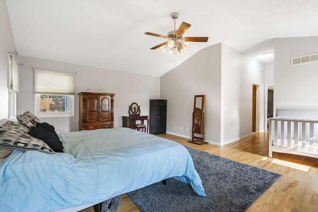 bedroom with lofted ceiling, ceiling fan, and light hardwood / wood-style floors