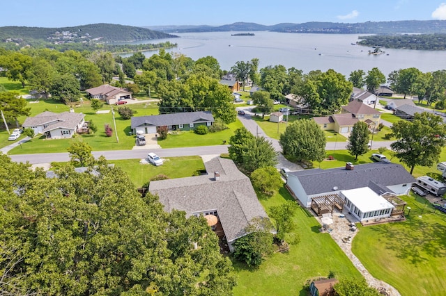 drone / aerial view featuring a water and mountain view