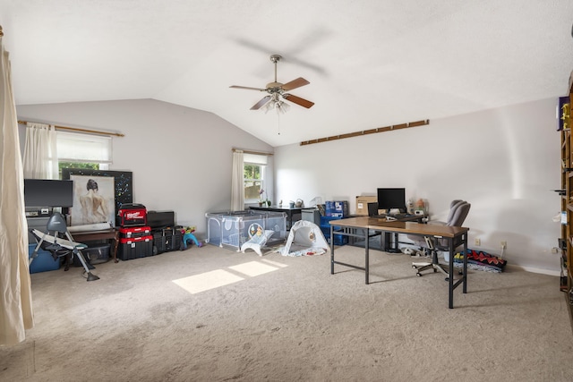 home office featuring ceiling fan, carpet floors, plenty of natural light, and vaulted ceiling