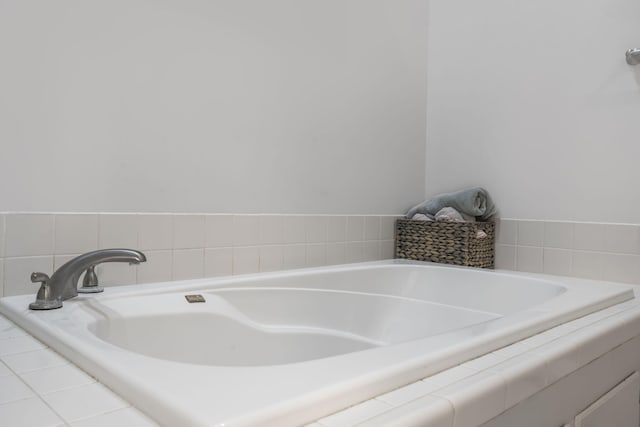 bathroom featuring tiled bath