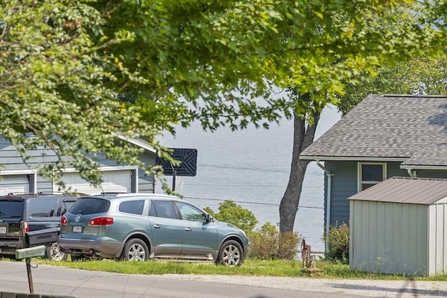 view of side of home featuring a storage unit